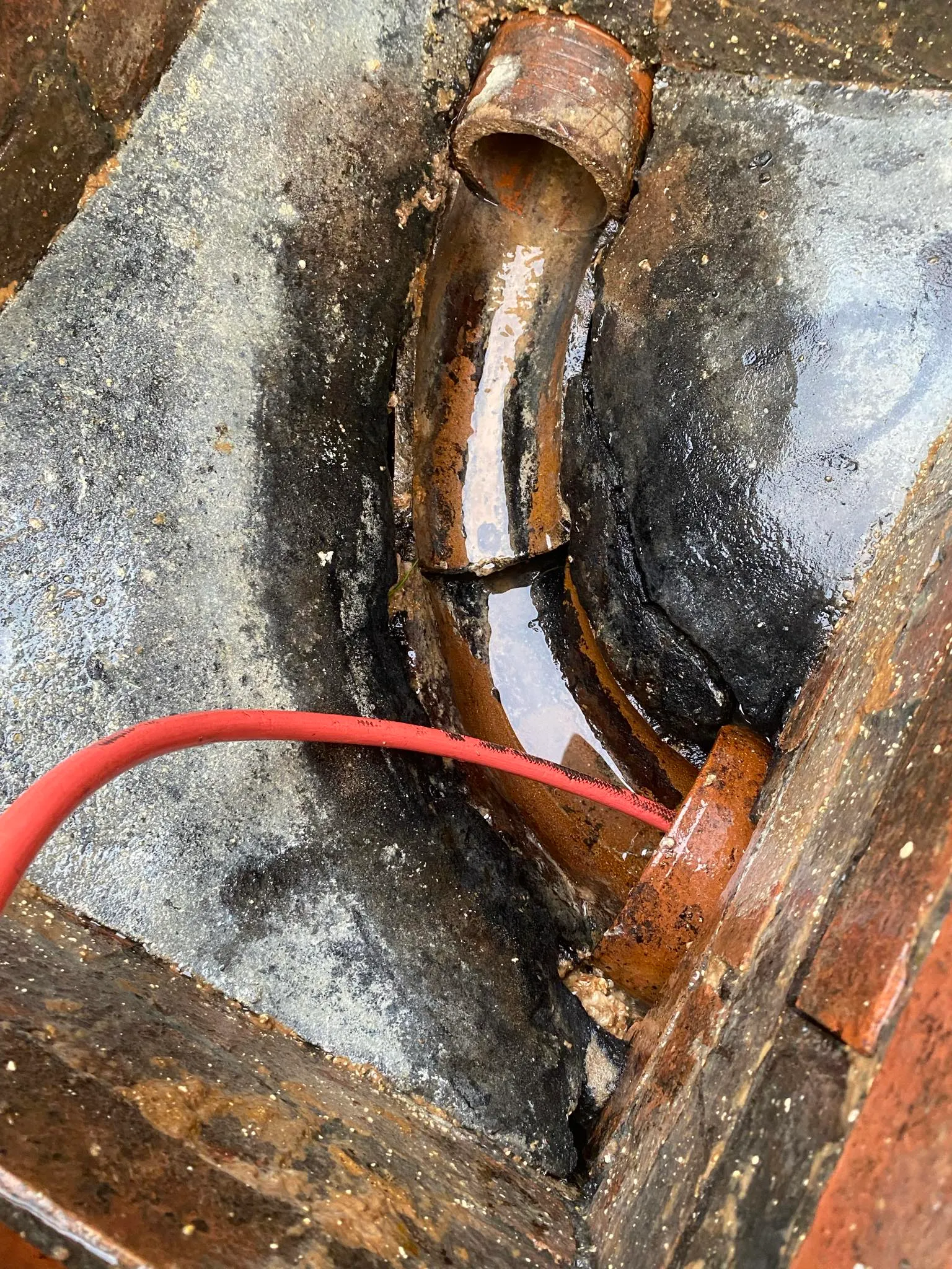 Clearing a blocked drain.